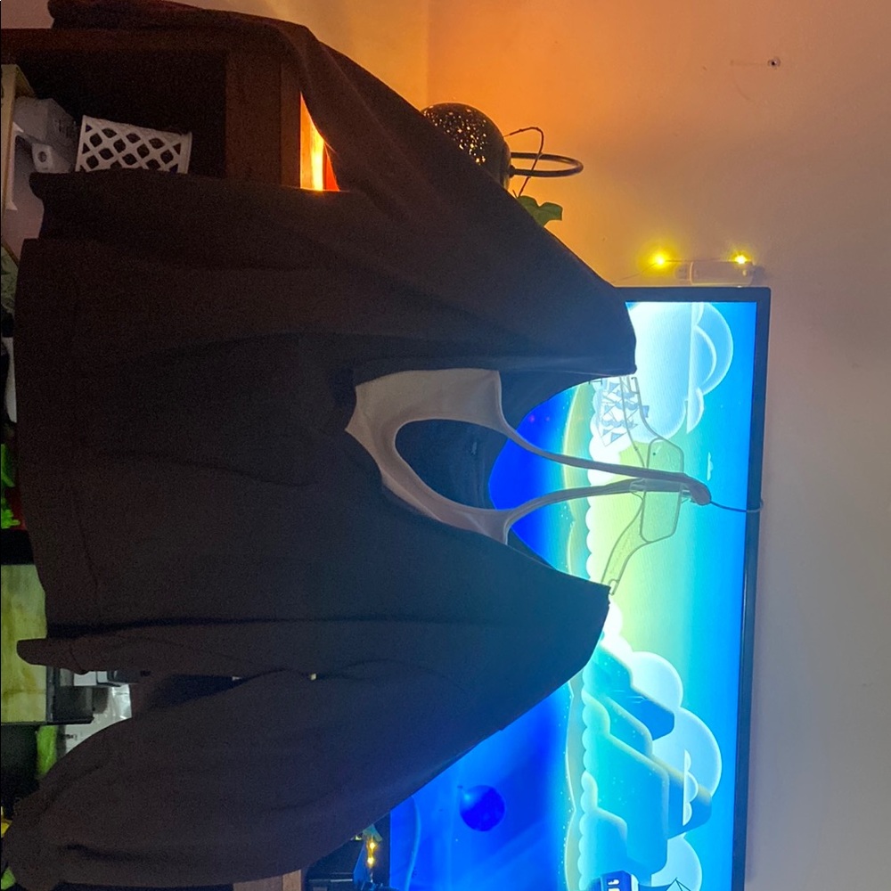 Cute brown long sleeved top with cream colored around the neck strap (connected)